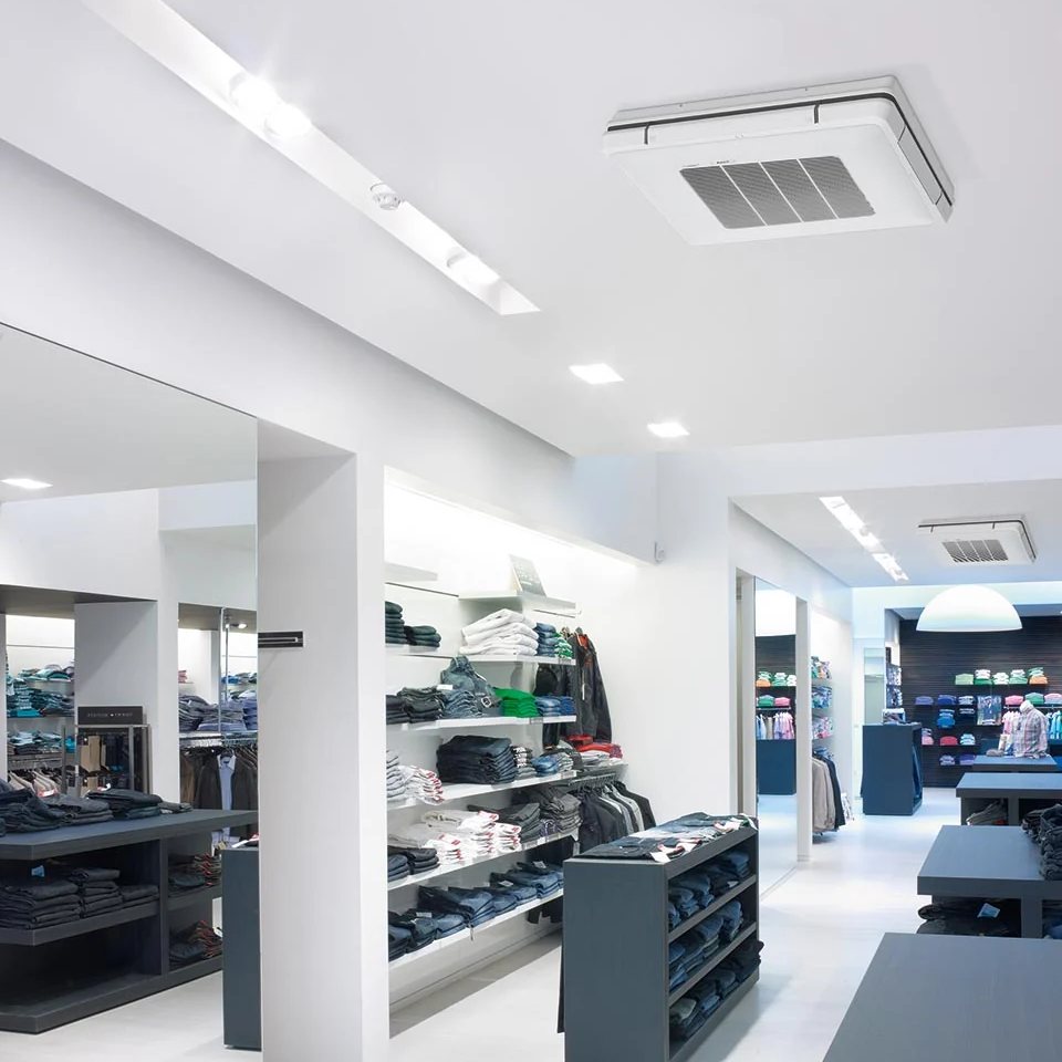 A ceiling-suspended indoor unit and ceiling cassettes in a clothing shop