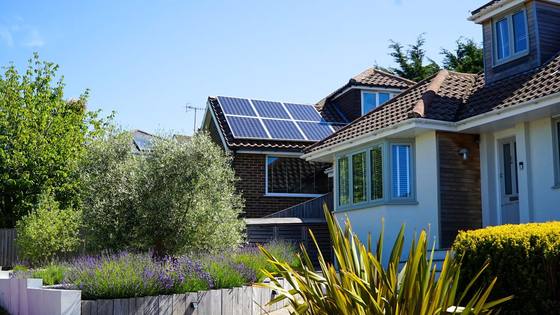 Solar panel array covering a full roof elevation